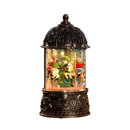 Decorative snow globe with Christmas scene inside a ornate lantern on a white background