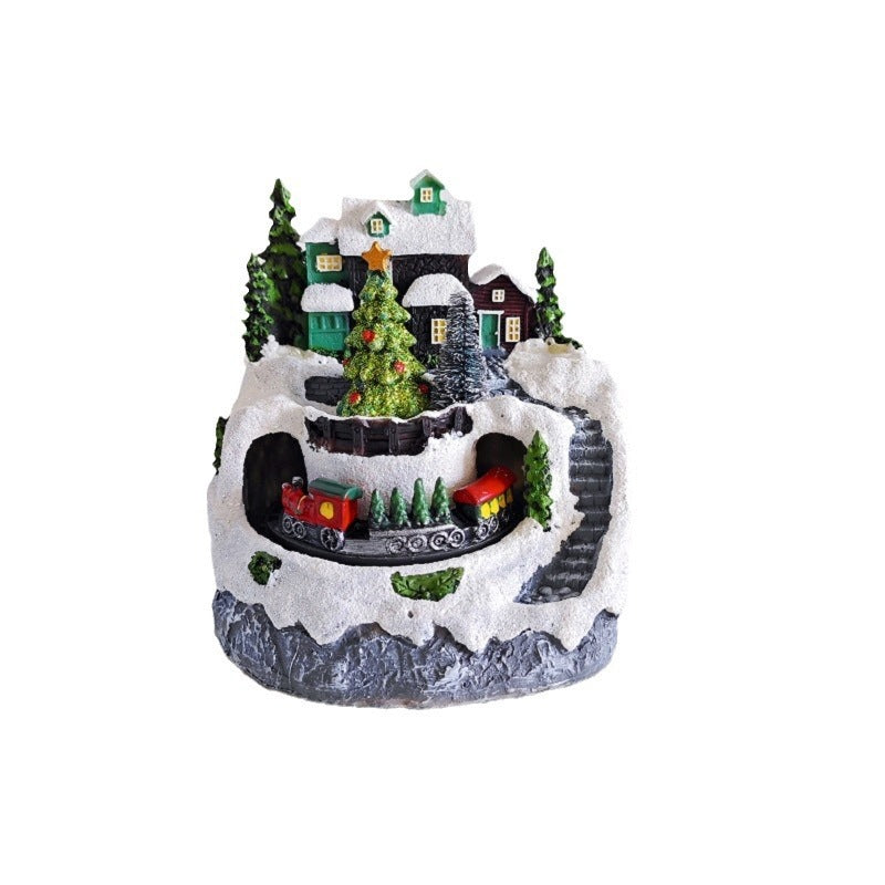 Decorative Christmas village scene with houses, trees, and a train on a white background