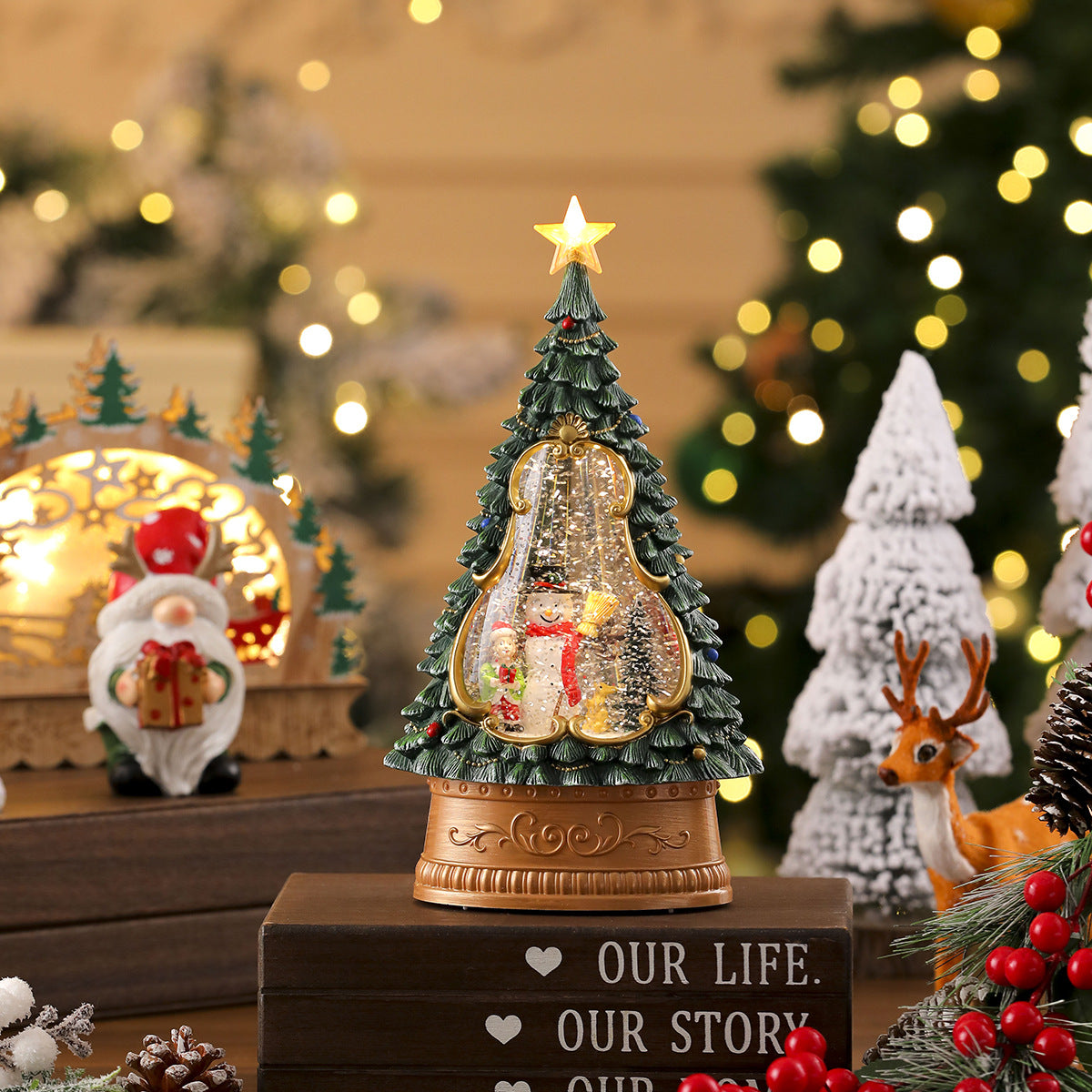 Decorative Christmas tree figurine with a star on top, surrounded by festive decorations.